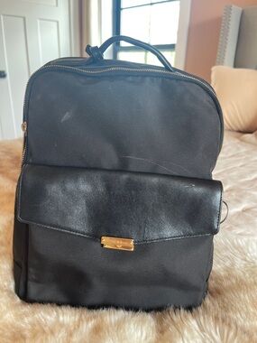 Tumi Black Nylon Backpack with Leather Flap and Gold Hardware